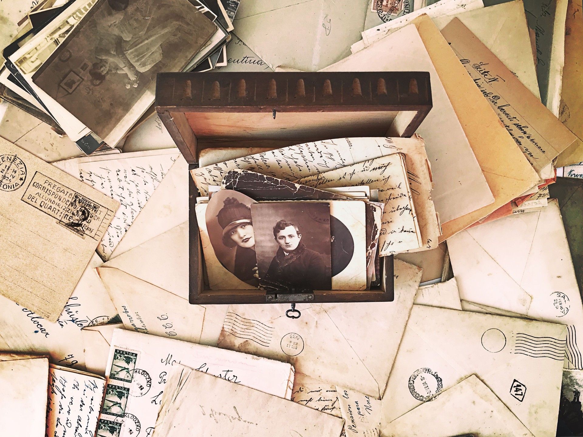 Vintage photographs and letters inside a wooden box